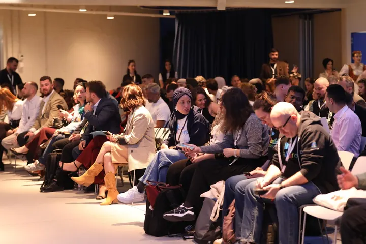 Attendees in the Innovation Hub at the Pyramid of Tirana