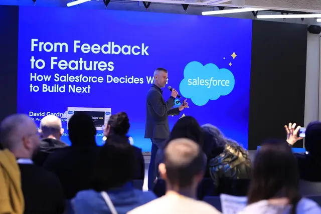 The Salesforce co-keynote on a big screen, with the audience in front